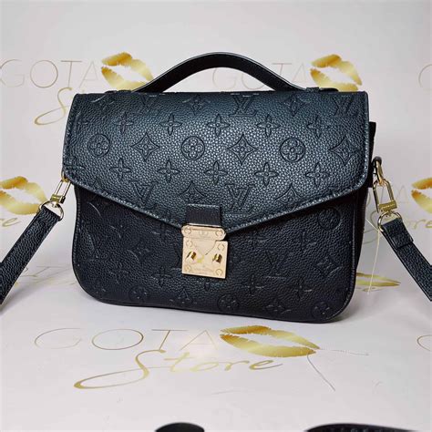 lv embossed leather bag.